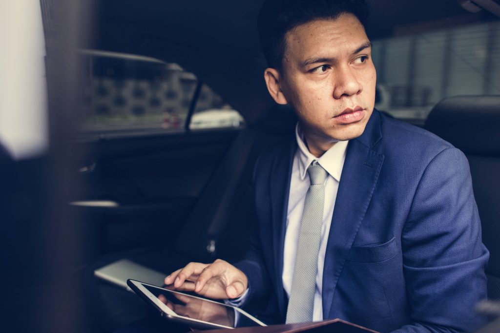 Businessman sitting in the car